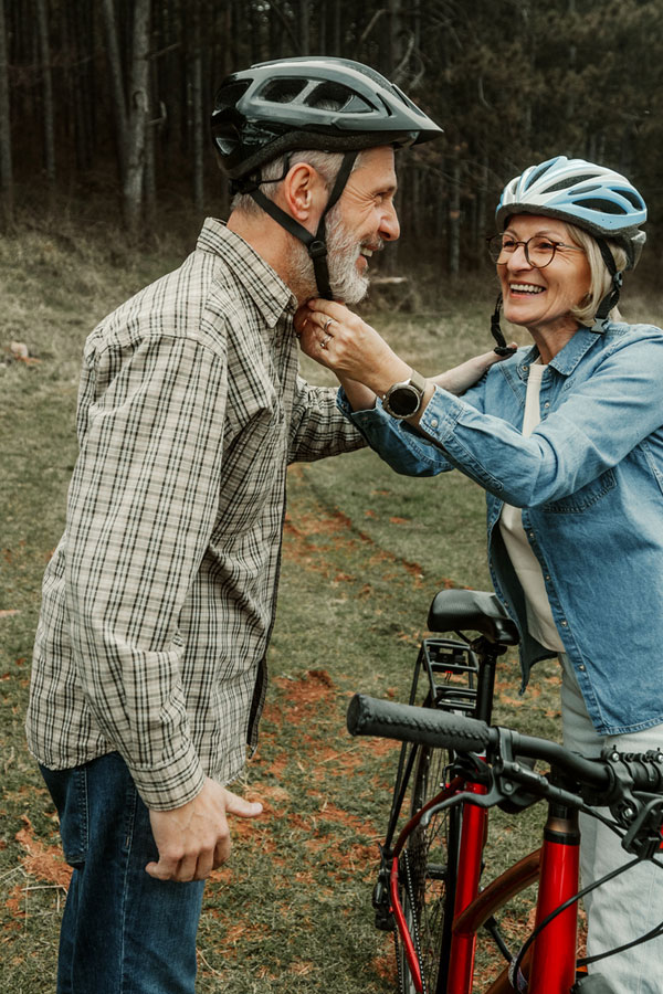 senior couple biking after endovascular surgery and a balloon angioplasty stent procedure